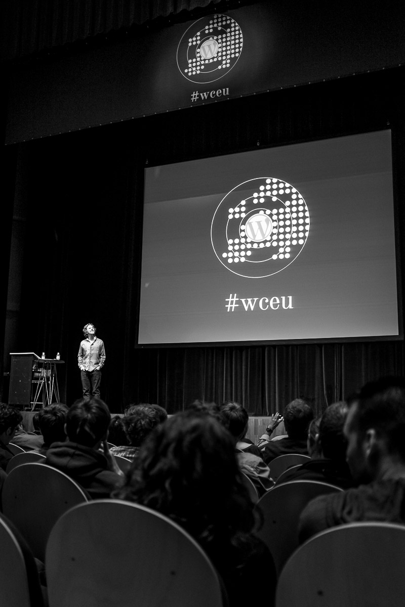 Matt Mullenweg, founding developer of WordPress, looks up to the balcony to answer a question during the Q&A session at WordCamp Europe 2013.