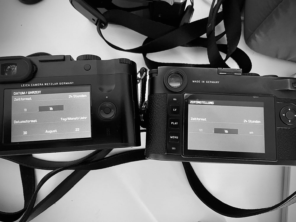 Two cameras with the date/time options showing identical times at 11:16