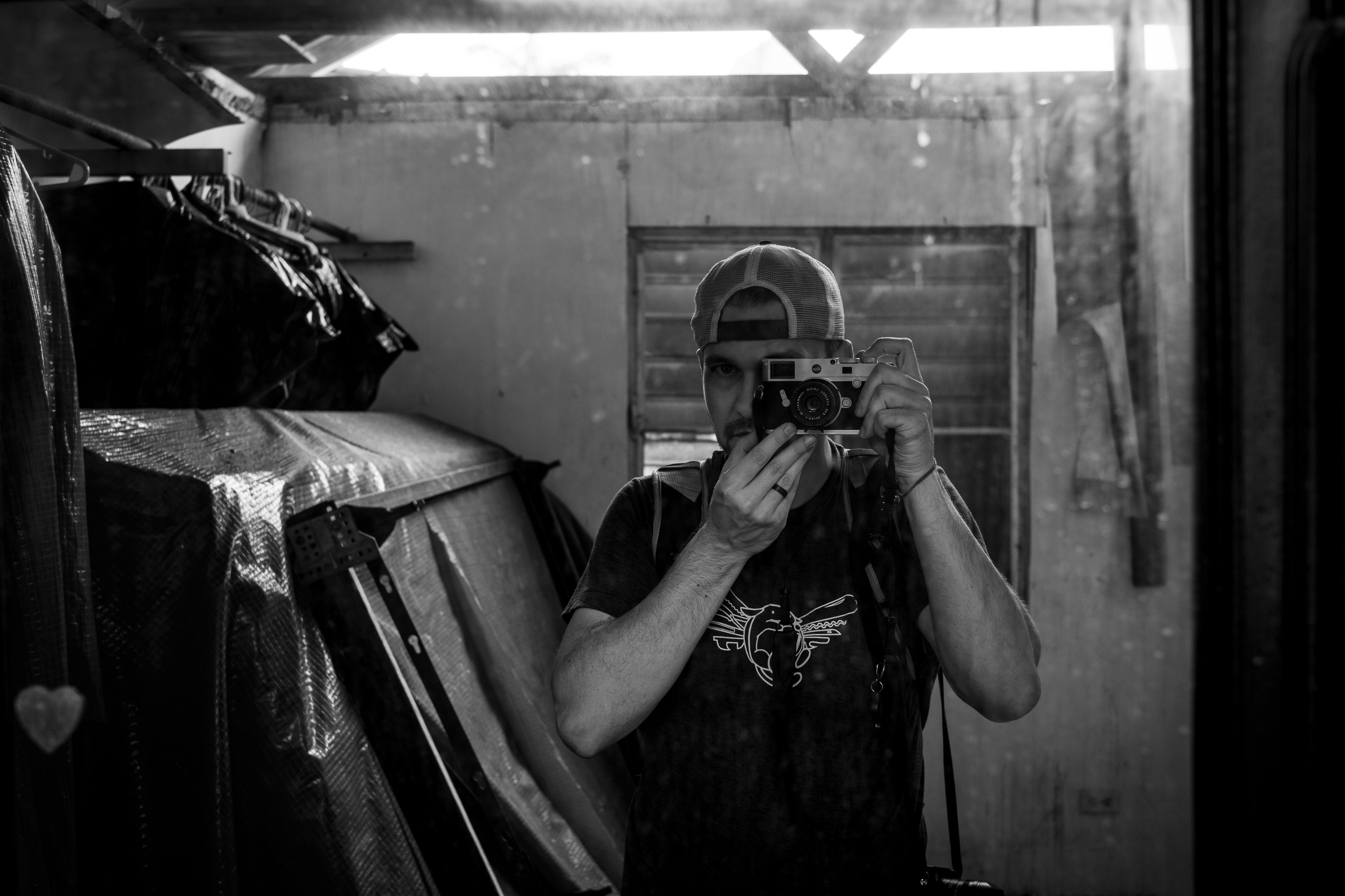 Me photographing myself through a mirror, inside a house, that was destroyed by hurricane Maria, Puerto Rico, October 2018.