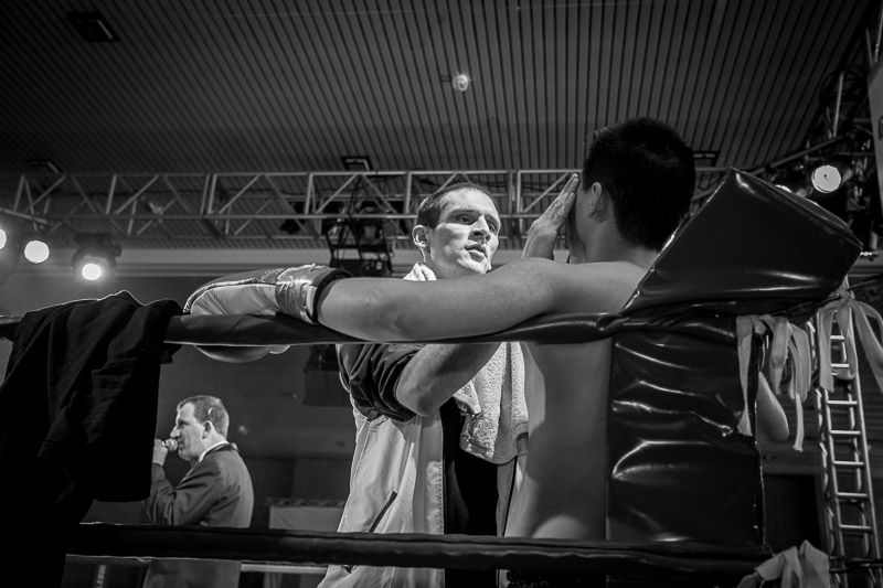Bernd Hargesheimer (c) prepares Yi-Ming Cheok (r) for his fight. It is Yi-Mings first official contest.