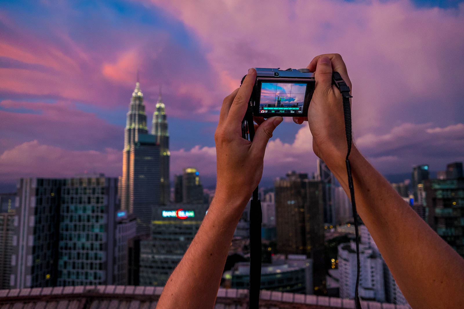 Taking a picuture of the Petronas Twin Towers in Kuala Lumpur during sunset