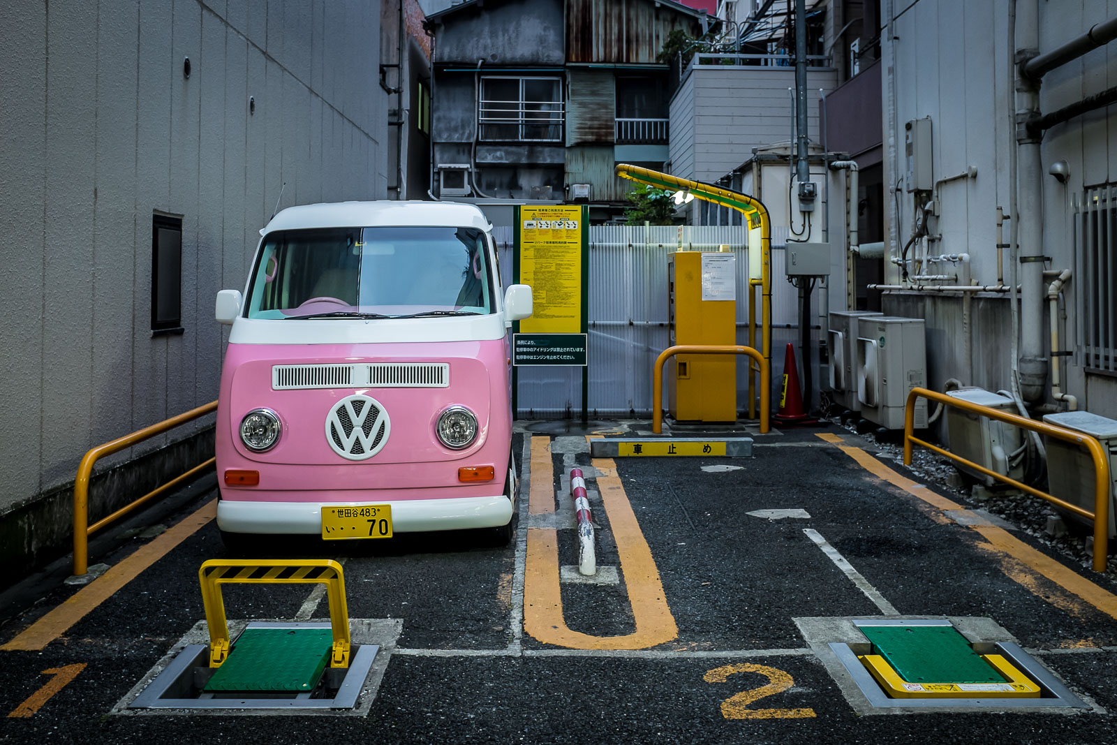Pink bus in a public parking lot in Yokohama