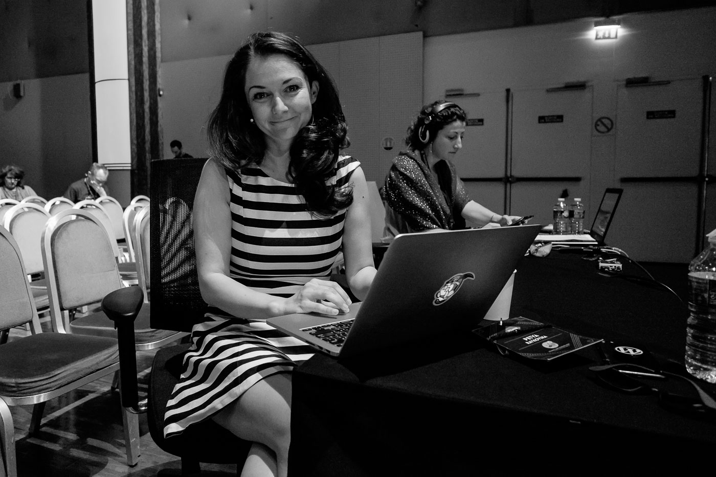 Petya sitting at her laptop smiling at the camera
