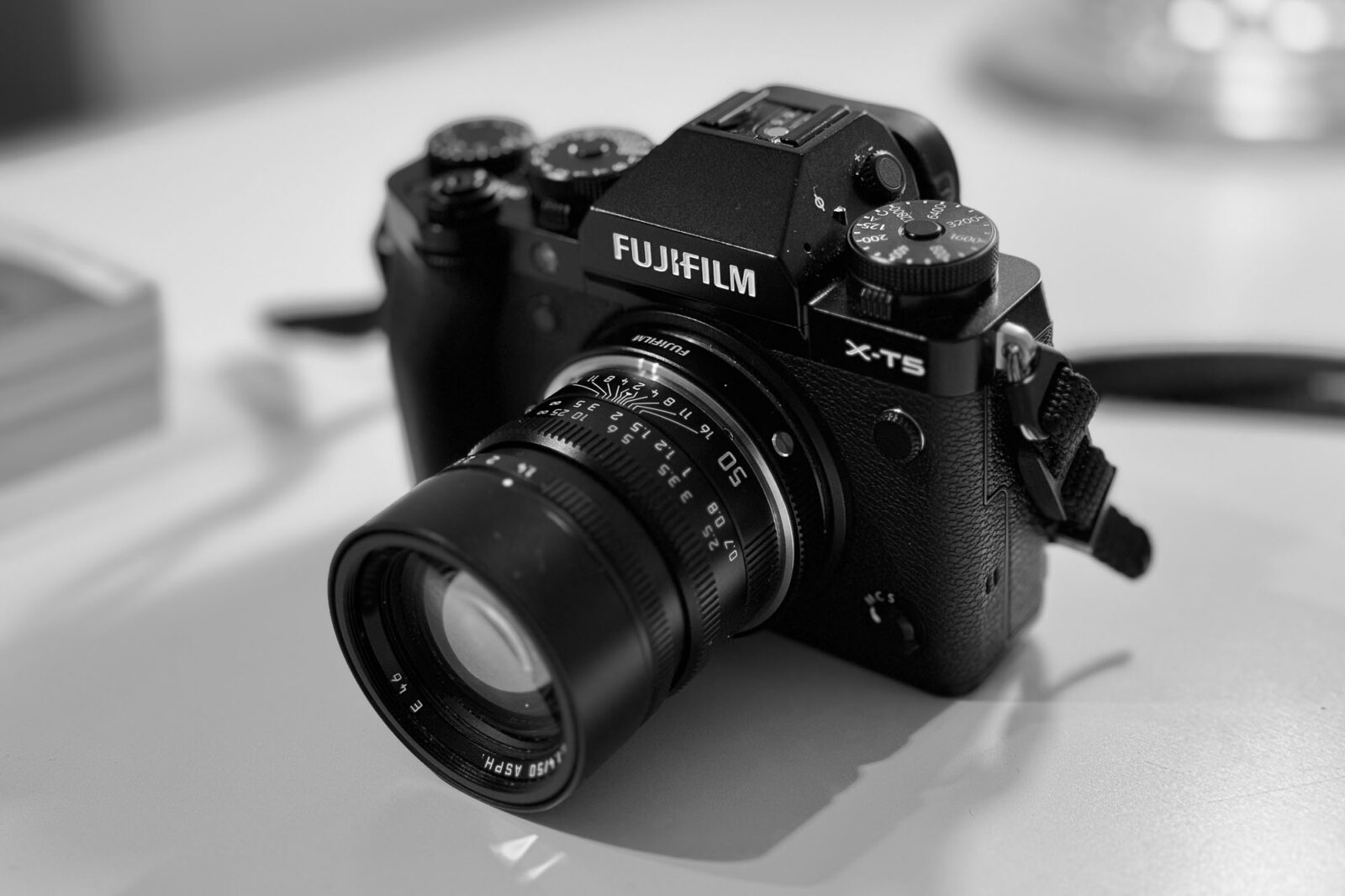 A 50 mm Leica lens is attached via an adapter to a Fujifilm X-T5 camera body